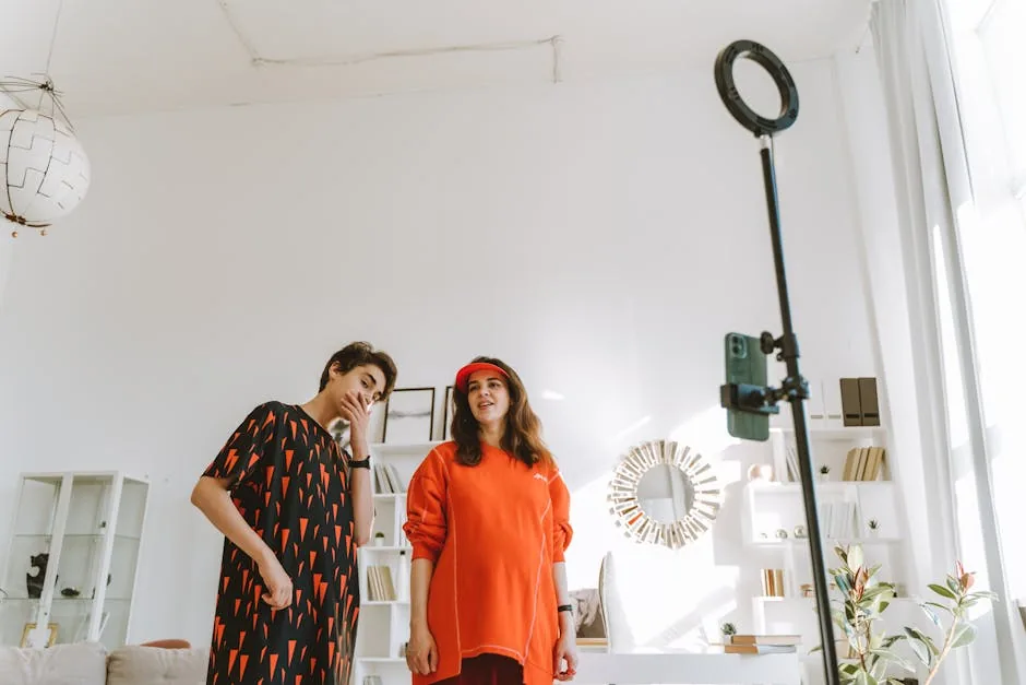 A stylish mother and teenage son capture a moment in a chic, well-lit home studio.
