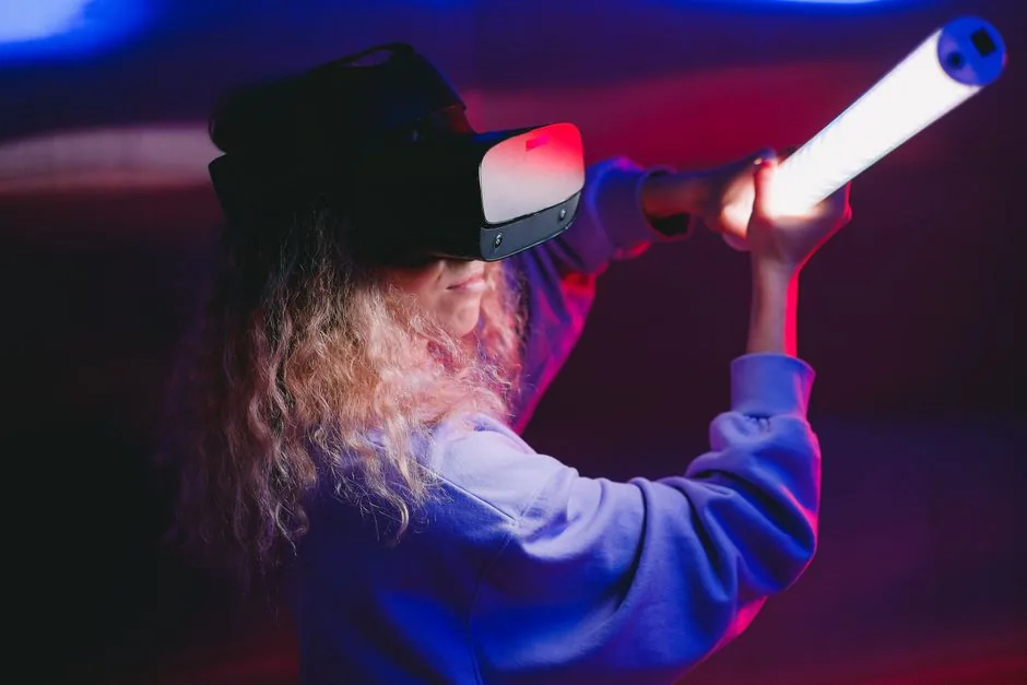 A woman wearing a VR headset plays an immersive game indoors with a LED light sword.