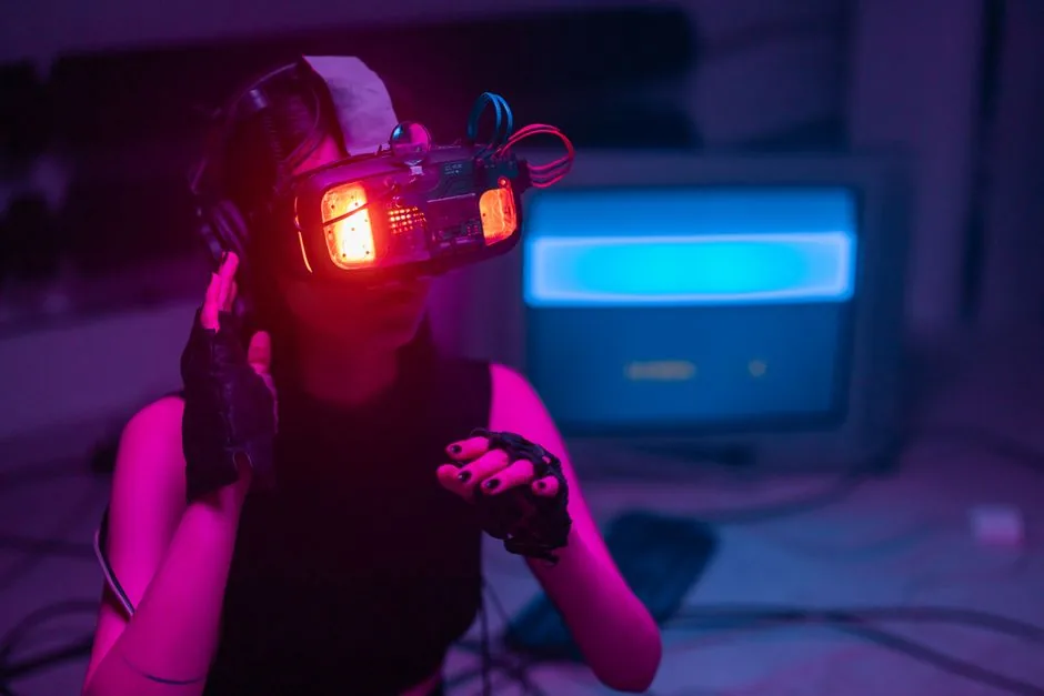 A woman immerses in virtual reality with neon-lit goggles and gloves in a tech-savvy environment.